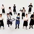 Group of People in Aprons and Uniforms Holding Trays and Wine Bottles