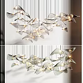 Modern Chandelier with Multiple Leaf Shaped Metallic Pieces and Illuminated Warm Glow for Contemporary Interiors