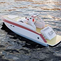White Yacht With Red Stripe And Yellow Deck Floating On Calm Water