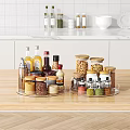 Organized Modern Kitchen Countertop With Rotating Assorted Spice And Condiment Bottles