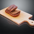 Fresh Sliced Bread on Wooden Cutting Board Against Black Background