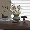 Floral Display With Green Vase White Orange Flowers Green Leaves And Books On Wooden Table