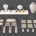 Elegant Jewelry Display With Necklaces On Mannequins Rings In Trays And Bracelets On Stands