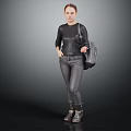 Woman Wearing Black Top Jeans And Boots Carrying Bag Against Gray Background