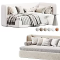 Modern Upholstered Sofa Bed With Multiple Pillows Striped Blanket And Neutral Colors