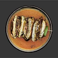 Freshly Made Layered Sandwiches With Vegetables Sauce And Lime Garnish On Dark Plate