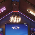 Stylish Bar Interior Featuring ShowTime Neon Lights Chandelier And Cozy Sofa Lounge With Cityscape Backdrop