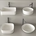 Contemporary Different Shapes White Bathroom Washbasins With Modern Faucets On Countertop