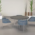 Modern Gray Lounge Chairs With Round Tables Green Plants And White Shelves In Indoor Setting