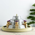 Garden Courtyard Design Featuring Tiered Fountain With Purple Flower Pots And Pine Tree