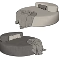 Comfortable Round Lazy Sofa in Beige and Gray with Soft Pillows and Blanket