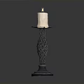 Lit Beige Candle On Decorative Braided Metal Candlestick Stand With Smooth Base