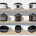 Assorted Kitchen Appliances on Wooden Shelves Featuring Electric Pressure Cookers and Rice Cookers