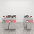 Two Silver Kitchen Fryers with Red Labels on Grey Floor and White Walls