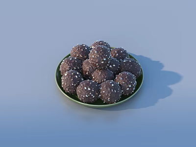 Pile Of Round Chocolate Truffles With White Sprinkles On Green Plate 3d model