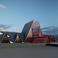 Modern Commercial Complex With Red Triangular Structures And Glass Facades Under Sunset Sky