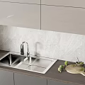 Stainless Steel Kitchen Sink With Modern Faucet On Marble Backsplash Countertop And Fresh Vegetables