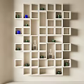 White Cube Wall Mounted Shelving Unit With Colorful Cups And Glass Bottles For Interior Decor