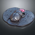 Black Metallic Decorative Scarab Figurine With Red Gemstone On Intricate Carved Base