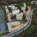 Aerial Planning of Modern Apartment Complex with Greenery and Roads in Organized Layout