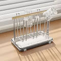 Stainless Steel Kitchen Decorative Storage Rack With Golden Rod And White Base On Wooden Countertop