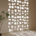 Light Colored Partition With Square Cutouts Sunlight Filtering Shadow Patterns Indoor Space With Green Plant