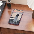 Modern Smartphone With Time Display Wallpaper And Purple Case On Wooden Table