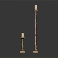Elegant Golden Candle Holders With Tall And Short Designs On Black Background