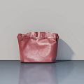 Red Leather Handbag Placed On Gray Surface With Smooth Gray Background Wall