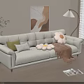 Beige Three Seater Sofa with Green Pillows Stuffed Bear and Blanket in Living Room with Floor Lamp
