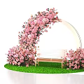 Floral Installation With Pink Flower Arch And Wooden Bench On Green Grass