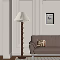 Warm Living Room Setup With Pleated Floor Lamp Brown Sofa Geometric Pillow And Wall Art