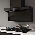 Modern Kitchen Appliances Featuring Black Range Hood And Gas Stove With Wok