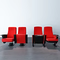 Red Theater Style Public Chairs With Armrests And Cup Holders On Dark Floor