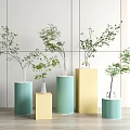 Modern Indoor Green And Yellow Ribbed Cylindrical Vases With Fresh Green Foliage