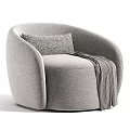 Light Gray Accent Chair with Rounded Design Woven Pattern Pillow and Gray Throw Blanket