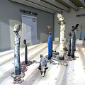 Indoor Sculpture Exhibition With Humanoid Animal Figures Pebbles And Wooden Ceiling