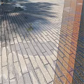 Outdoor Ground Surface Neatly Laid With Patterned Bricks And Natural Shadows