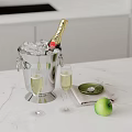 Champagne Bottle and Wine Glasses on Marble Table with Ice Bucket Green Apple