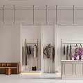 Elegant Clothing Store With White Walls Golden Racks Mannequin Brown Sofa And Purple Flowers