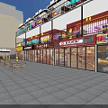 Multi Storey Commercial Complex With Shops Neon Signs And Surrounding High Rise Buildings