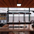 Modern Tea Room Interior With Wooden Ceiling Large Windows Wooden Table And Tea Product Shelves