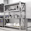Stainless Steel Kitchen Cabinets With Shelves Holding Plates And Cookware