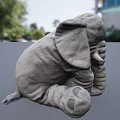 Gray Stuffed Elephant Toy with Textured Surface and Detailed White Tusks