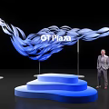 Blue Wavy Art Installation At G1 Plaza With Step Platform And Standing Person