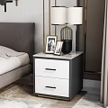 Black and White Bedside Tables with Marble Top Drawers Lamps and Photo Frames