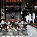 Marvel Heroes Themed Restaurant With Industrial Style Metal Tables Chairs And Hero Statues