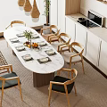 Modern Dining Table Set with Wooden Chairs Pendant Lights Plants and White Cabinets