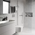 Modern Bathroom Interior Design Featuring Vanity Toilet Shower And Gray Tile Wall Niche