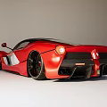 Red Supercar With Sleek Streamlined Body And White Accents Black Wheels